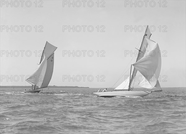 The 8 Metre 'Antwerpia' (H19) and 'Windflower' (H3) racing under spinnaker, 1911. Creator: Kirk & Sons of Cowes.