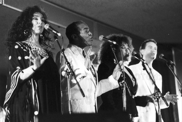 Jon Hendricks with three unidentified singers, c1998. Creator: Brian Foskett.