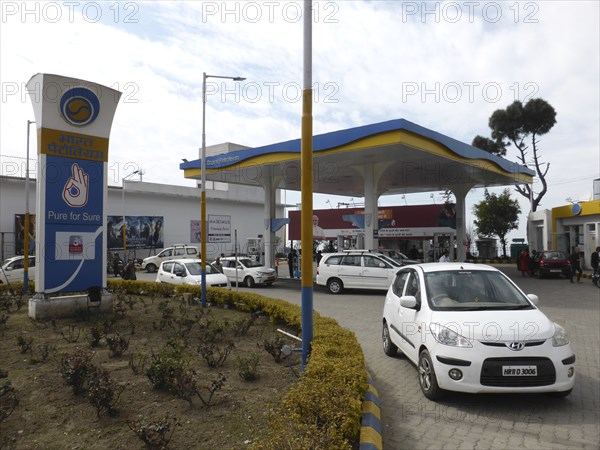 Cars re-fuelling at petrol station Dharamshala Himachal Pradesh. Creator: Unknown.