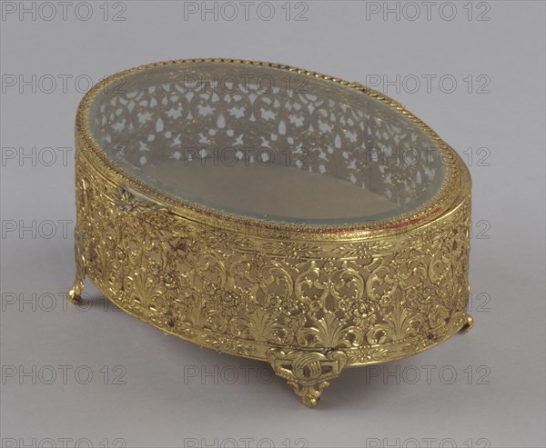 Gold metal scrollwork jewelry box from Mae's Millinery Shop, 1941-1994. Creator: Unknown.