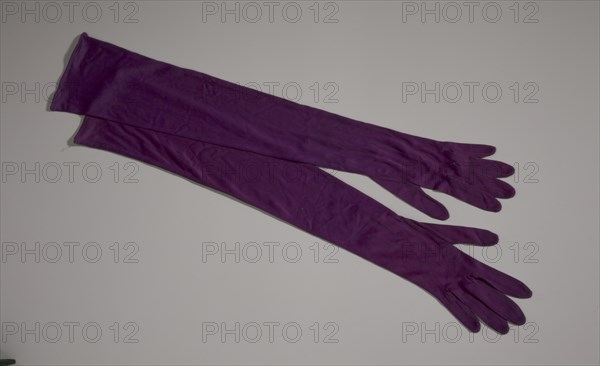 Pair of arm length purple gloves from Mae's Millinery Shop, 1941-1994. Creator: Van Raalte.