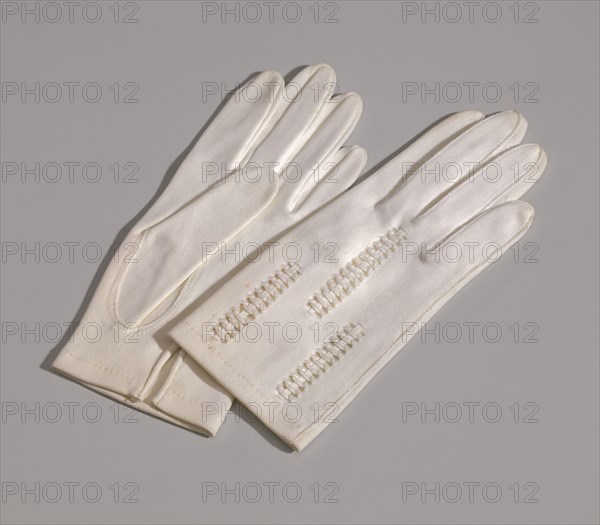 Pair of light cream gloves with openwork design from Mae's Millinery Shop, 1941-1994. Creator: Van Raalte.
