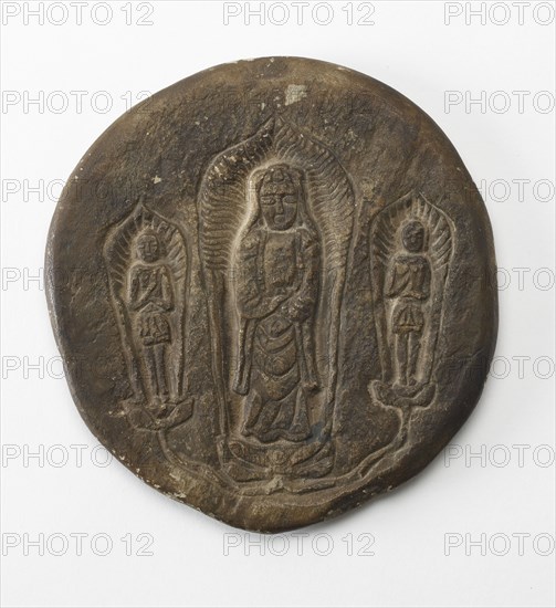 Circular plaque with Buddhist trinity on obverse..., Period of Division, Dated 500 CE. Creator: Unknown.