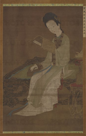 Young woman reading a book of poems, Ming dynasty, 16th-17th century. Creator: Unknown.