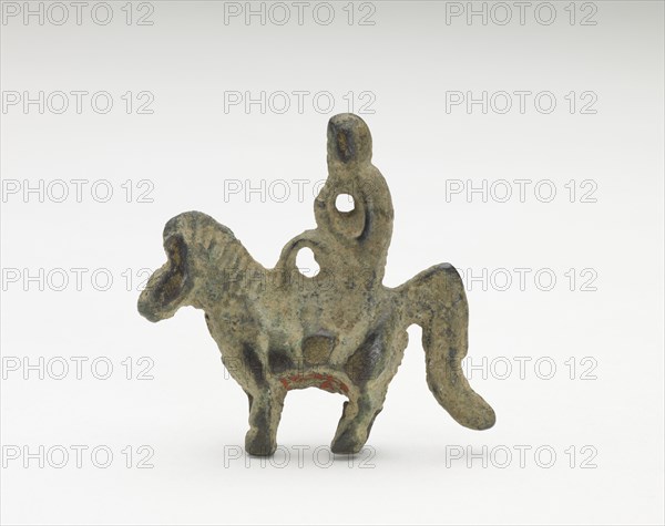 Ornament in the form of possibly a monkey riding a horse, Period of Division, 220-589. Creator: Unknown.