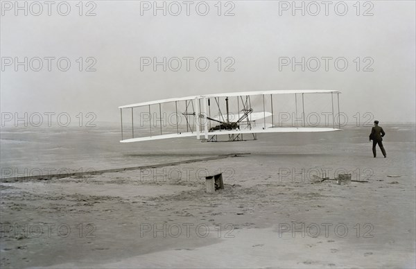 First flight of Wright brothers aircraft, Kitty Hawk, North Carolina, USA, December 17, 1903.  Creator: Unknown.