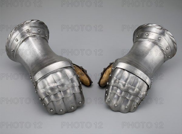 Pair of Mitten Gauntlets, Flanders, c. 1520 with modern restorations. Creator: Unknown.