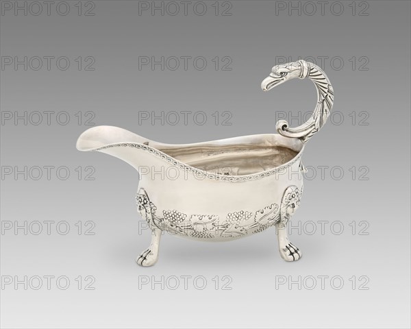 Sauce Boat, c. 1817/33. Bunches of grapes and vineleaves decoration, with handle in the shape of a bird of prey.