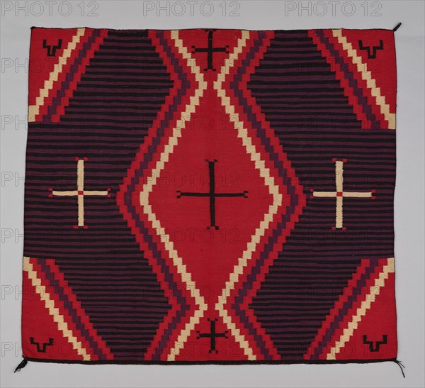 Chief Blanket (Third Phase), c. 1880. A work made of wool, dovetail tapestry weave with "lazy lines"; twined warp ends and selvages; corner tassels.