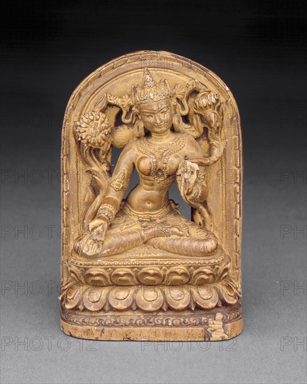 Goddess White Tara with Kneeling Donor at Base, c. 12th century.