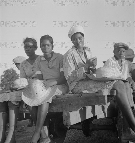 Women being transported from Memphis, Tennessee to an Arkansas plantation, 1937. Creator: Dorothea Lange.