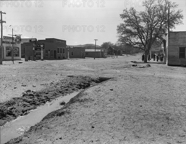 Main street of town showing irrigation ditch, Escalante, Utah, 1936. Creator: Dorothea Lange.