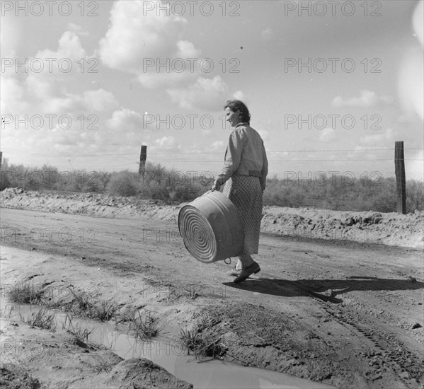 In a migratory labor camp, California, 1936. Creator: Dorothea Lange.