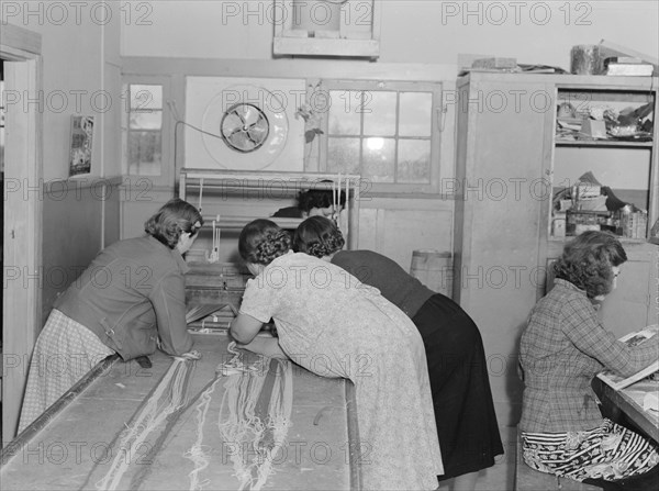 In the sewing room, Shafter camp for migrants (FSA), California, 1938. Creator: Dorothea Lange.