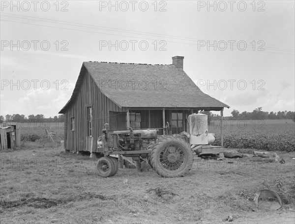 Tractors with pneumatic tires are replacing mules on the Delta plantations, Arkansas, 1939. Creator: Dorothea Lange.