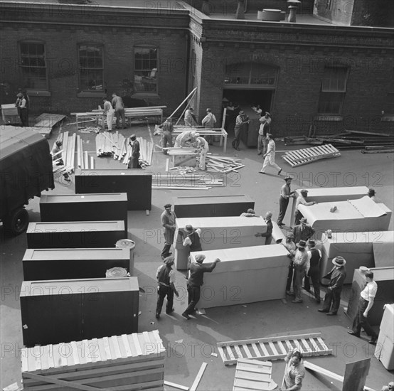 Possibly: United States government workers and carpenters making crates..., Washington, D.C., 1942. Creator: Gordon Parks.