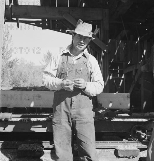 Possibly: Men working in mill, Ola self-help sawmill co-op, Gem County, Idaho, 1939. Creator: Dorothea Lange.