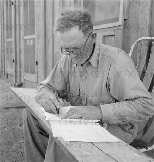 Oklahoma farmer, now living in Cow Hollow, is a FSA borrower, Malheur County, Oregon, 1939. Creator: Dorothea Lange.