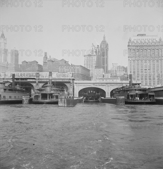 Ferry boats still make train connections which transports passengers in...of New York City, 1939. Creator: Dorothea Lange.