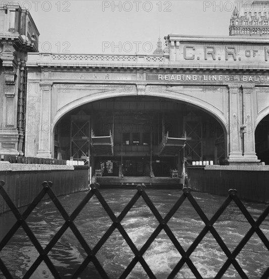 Ferry slip seen from ferry which transports passengers across the Hudson..., New York City, 1939. Creator: Dorothea Lange.