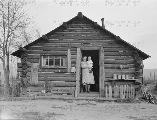 Log house now occupied and enlarged by the Halley family, Bonner County, Idaho, 1939. Creator: Dorothea Lange.