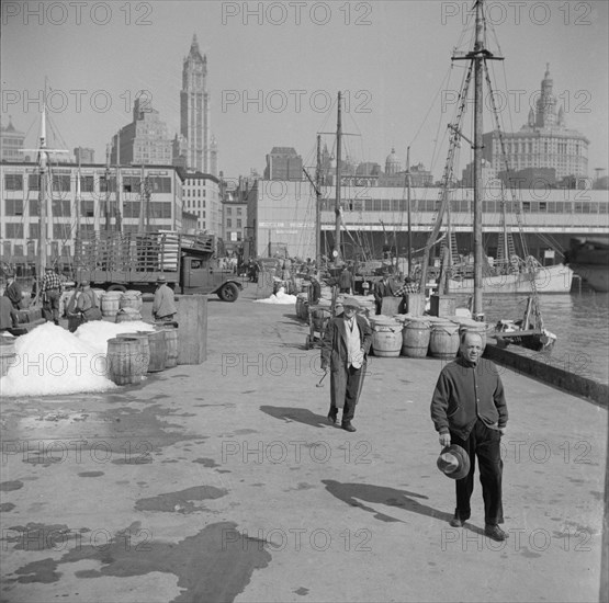 Possibly: Barrels of fish on the docks at Fulton fish market ready to be shipped..., New York, 1943. Creator: Gordon Parks.