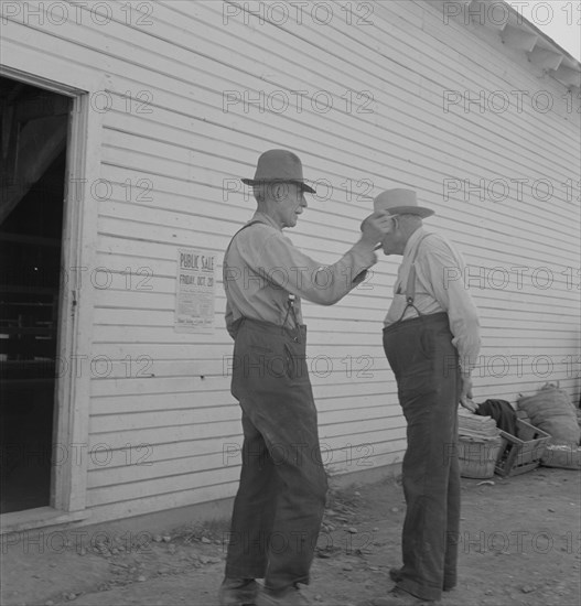 Oregon farmers, old settlers, at farmer's public sale, Saturday. Nyssa, Malheur County, Oregon.