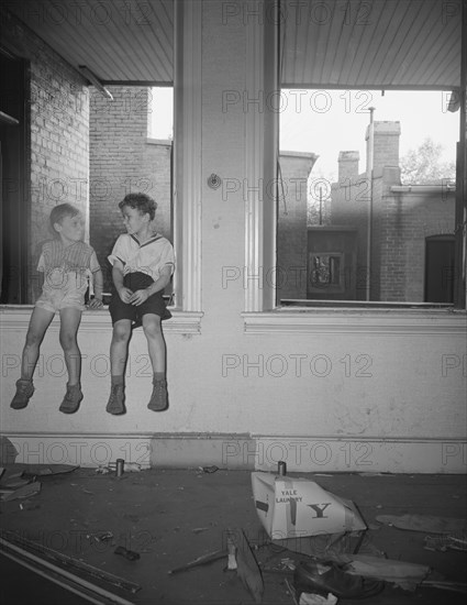 Washington, D.C. Children playing in wrecked houses along Independence Avenue.