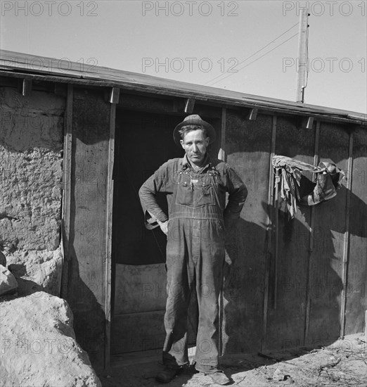 Mr. Roberts in front of his Owyhee project home. Malheur County, Oregon.