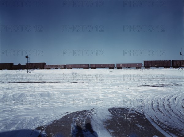 Train going over the hump at C & NW RR's Proviso yard, Chicago, Ill., 1942. Creator: Jack Delano.