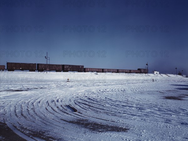 Train going over the hump at C & NW RR's Proviso yard, Chicago, Ill., 1942. Creator: Jack Delano.