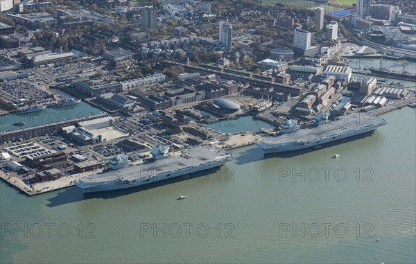 The Royal Navy's two largest aircraft carriers in dock, Portsmouth, Hampshire, 2020. Creator: Damian Grady.