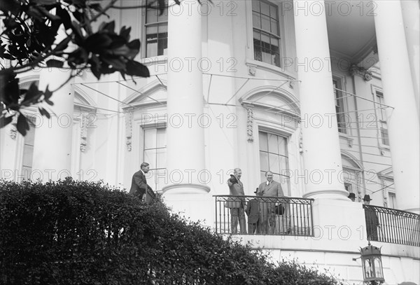 Hughes, William, Rep. from New Jersey, 1903-1912; Senator, 1913-1918. with Wilson, Watching..., 1913 Creator: Harris & Ewing.