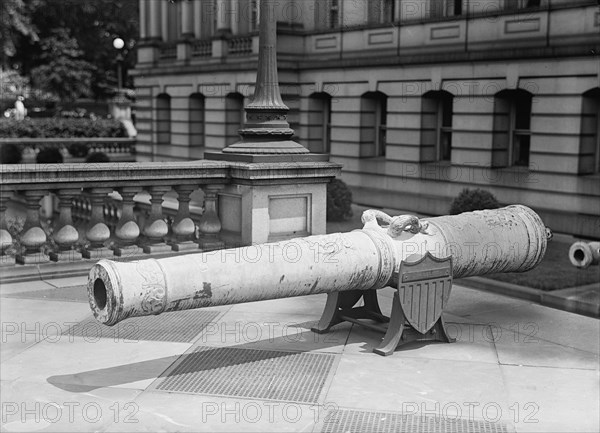 Medals, Decorations, Etc. - Spanish Gun at War Department Made Into Medals, 1917. Creator: Harris & Ewing.