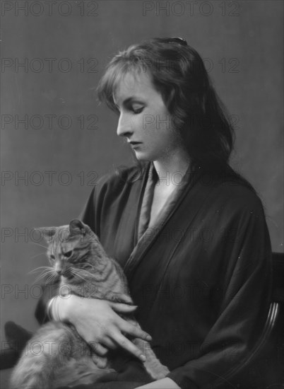 Whittaker, Miss, with Buzzer the cat, portrait photograph, 1916. Creator: Arnold Genthe.