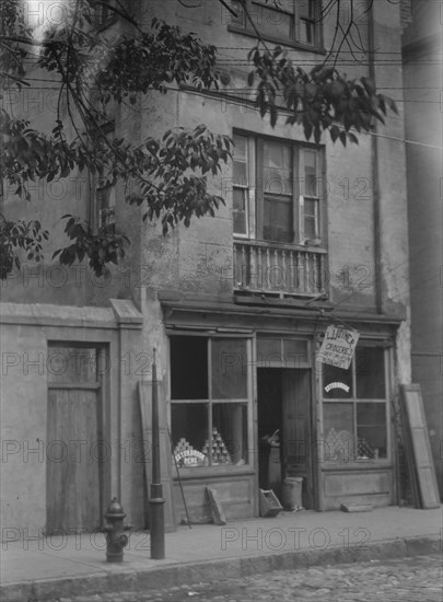 Facade of a grocery store, New Orleans or Charleston, South Carolina, between 1920 and 1926. Creator: Arnold Genthe.