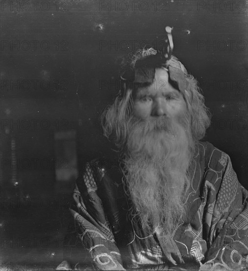 Ainu chief wearing a headdress, 1908. Creator: Arnold Genthe.