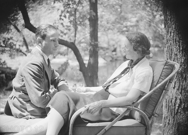 Mrs. Mary Benson and unidentified man, seated outdoors, 1933. Creator: Arnold Genthe.