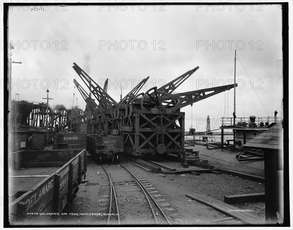 Unloading ore from whaleback, Buffalo, c1900. Creator: Unknown.