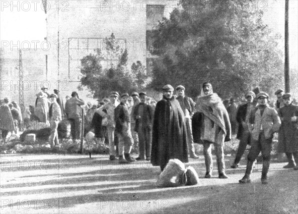 The Dark Hours of Italy; Refugees from Friuli in a square in Brescia, 1917. Creator: Unknown.