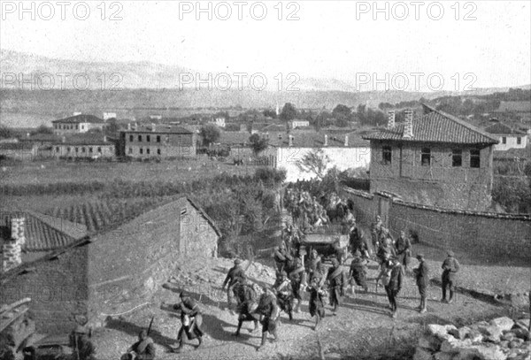 On the Eastern Front; Our Zouaves cross Pogradec, at the southern end of Lake Ohrid..., 1917. Creator: Unknown.