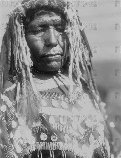 Wife of Weasel Head-Piegan, c1910. Creator: Edward Sheriff Curtis.