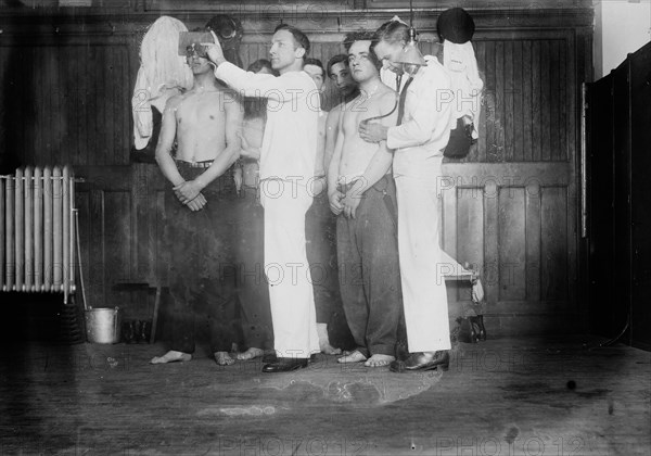 Examining new Navy Recruits, between c1910 and c1915. Creator: Bain News Service.