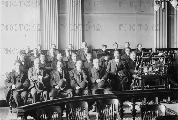 Candidates for naturalization seated in room, hats in laps, 1916. Creator: Bain News Service.