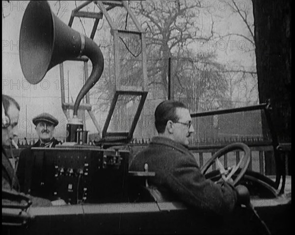 A Car on the Road Equipped with a Radio, an Aerial, and Speakers, 1922. Creator: British Pathe Ltd.