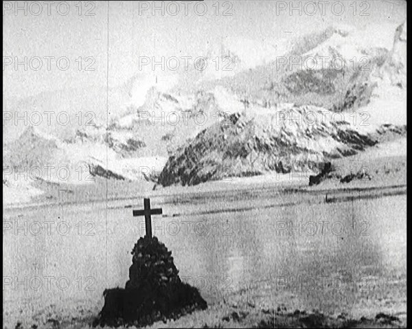 Sir Ernest Shackleton's Grave, Marked with a Cross, on South Georgia Island, 1922. Creator: British Pathe Ltd.