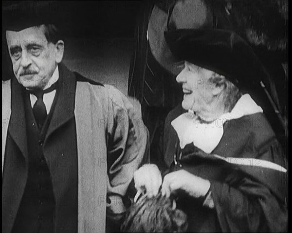 Sir James Barrie and Elen Terry Sitting Together in Academic Dress Outside St Andrew's Uni..., 1922. Creator: British Pathe Ltd.