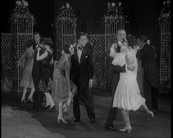 A Group of People Dancing the Charleston. One Female Civilian is Rubbing Her Legs is Pain, 1926. Creator: British Pathe Ltd.