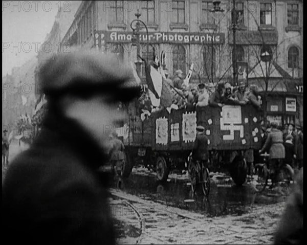 National Socialist (Nazi) Party Campaigning in Germany Scattering Pamphlets from  Trucks..., 1926. Creator: British Pathe Ltd.