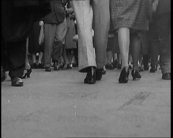 The Shoes and Legs of Crowds of People Walking the Streets of London, 1929. Creator: British Pathe Ltd.